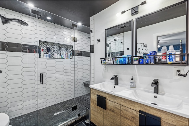 bathroom with vanity and a shower with door