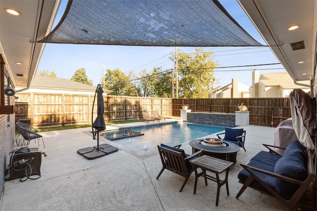 view of swimming pool with a patio area