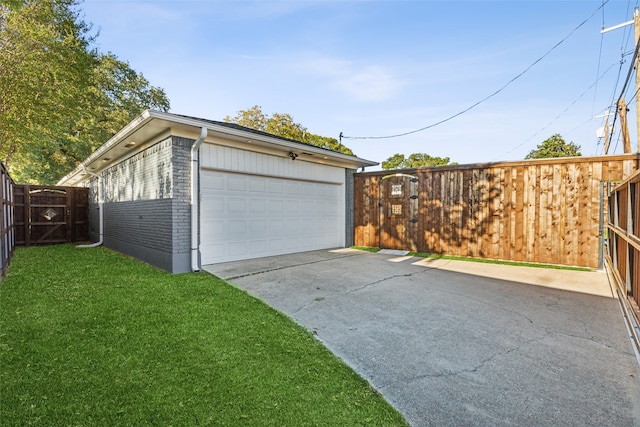 garage featuring a lawn