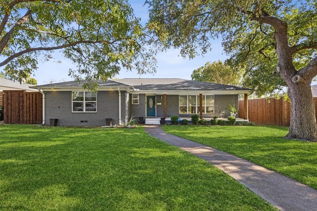 ranch-style house featuring a front lawn