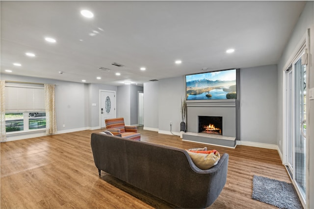 living room with light hardwood / wood-style flooring