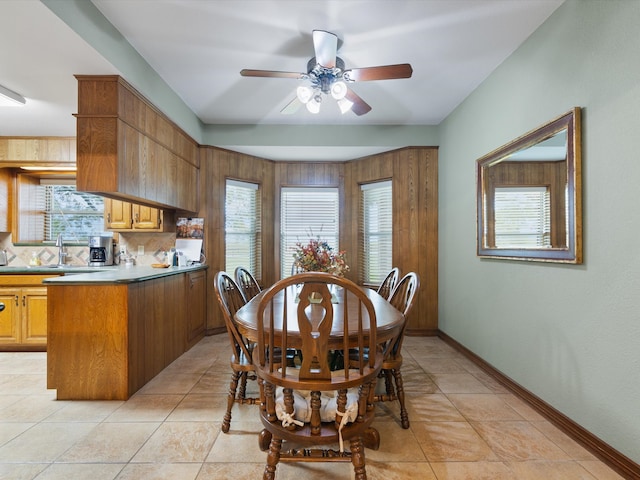 dining area with ceiling fan, a healthy amount of sunlight, and light tile patterned flooring