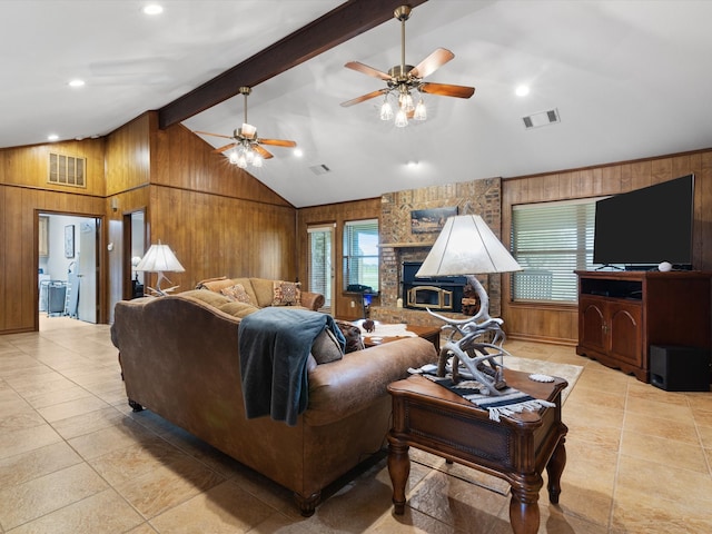 living room with wooden walls, beamed ceiling, high vaulted ceiling, and ceiling fan