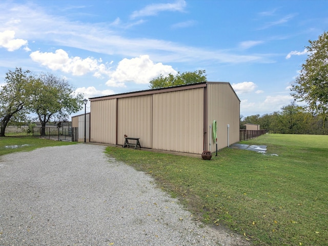 view of outbuilding with a lawn