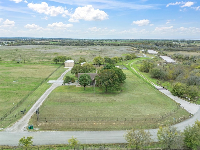 birds eye view of property with a rural view