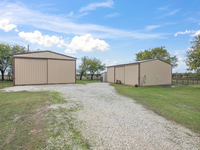 view of outbuilding with a yard