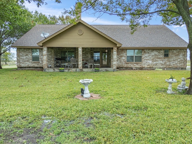 view of front of house with a front lawn and covered porch