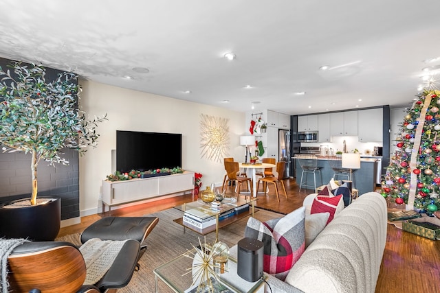 living room with dark hardwood / wood-style flooring