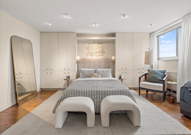 bedroom with hardwood / wood-style floors