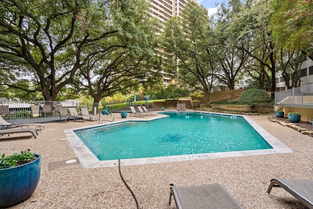 view of pool featuring a patio area