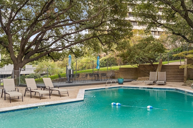 view of swimming pool featuring a patio