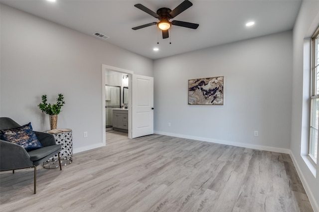 sitting room with ceiling fan and light hardwood / wood-style floors