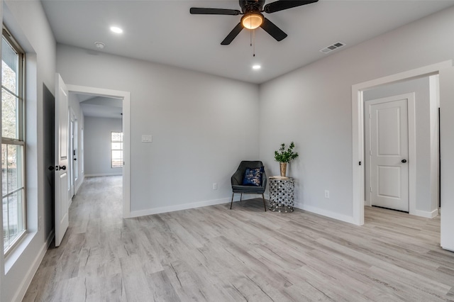 unfurnished room featuring ceiling fan and light hardwood / wood-style flooring