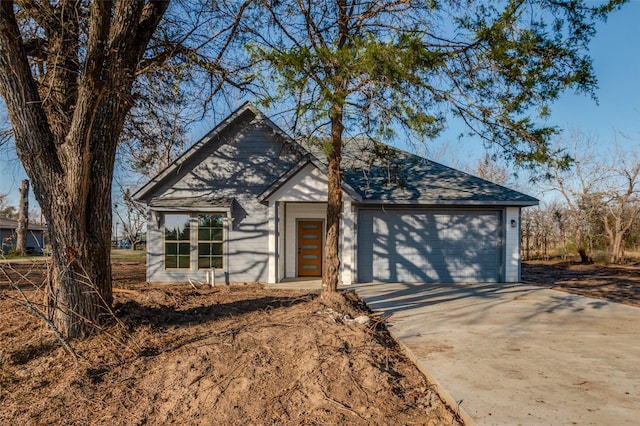 view of front of property with an attached garage and concrete driveway