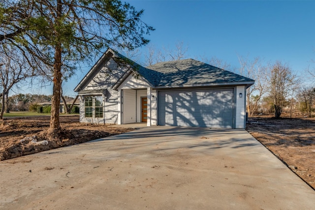 view of front facade featuring driveway and an attached garage