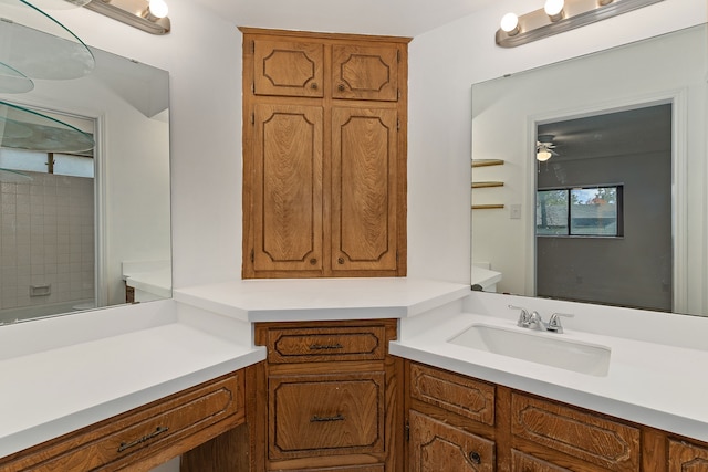 bathroom featuring vanity and toilet