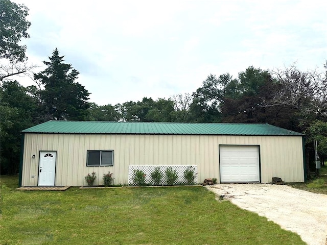 garage with a lawn