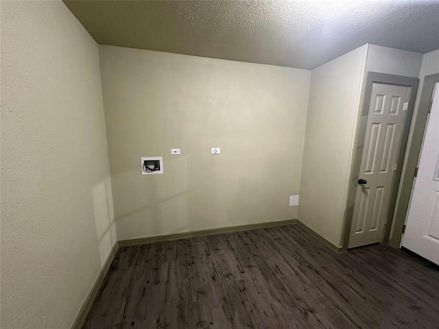 laundry area featuring hookup for a washing machine, a textured ceiling, and dark hardwood / wood-style flooring