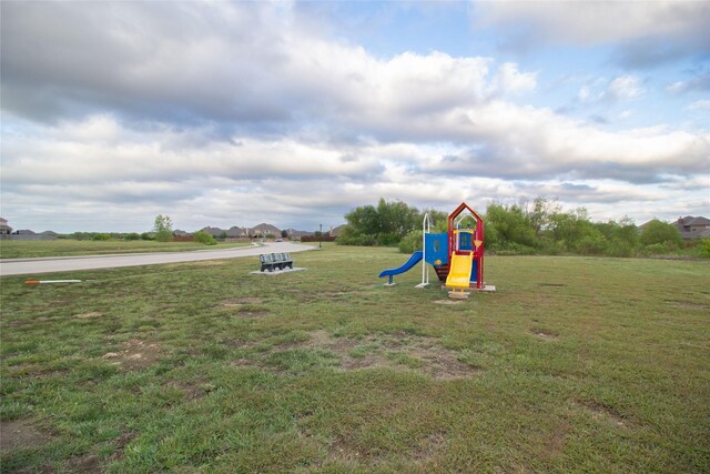 view of playground featuring a lawn