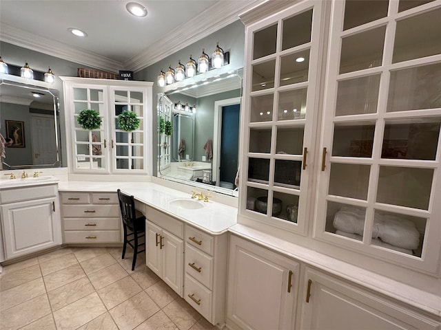 bathroom with crown molding, tile patterned flooring, and vanity