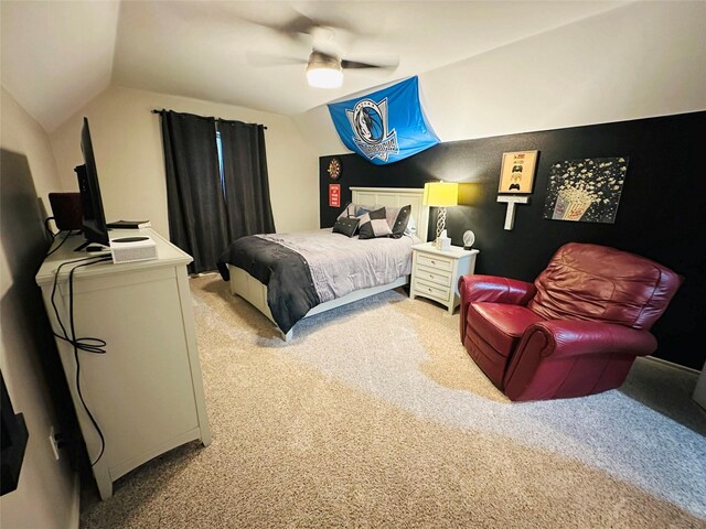 bedroom featuring ceiling fan, light colored carpet, and vaulted ceiling