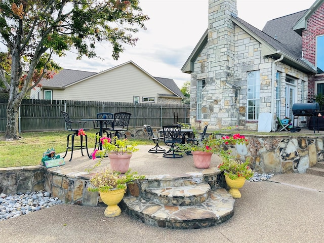 view of patio with a grill