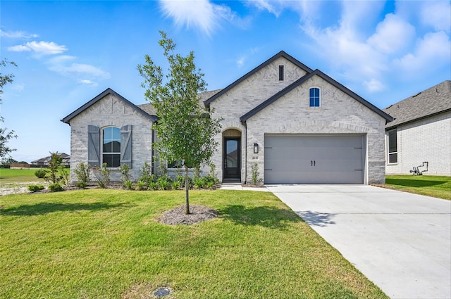 2131 Charming Forge Rd, Forney, TX 75126 - french country home with a garage, driveway, a front yard, and brick siding