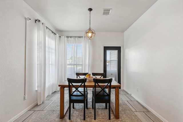 dining area featuring light wood-type flooring