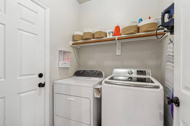 washroom featuring washer and dryer