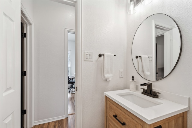 bathroom featuring vanity and wood-type flooring