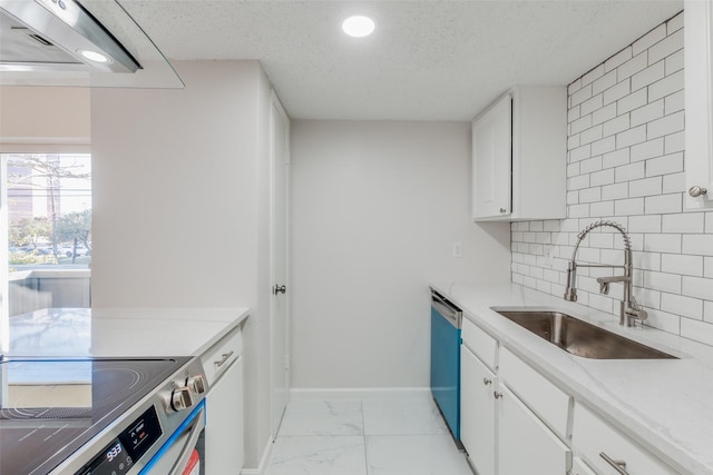 kitchen with white cabinets, sink, a textured ceiling, tasteful backsplash, and stainless steel appliances