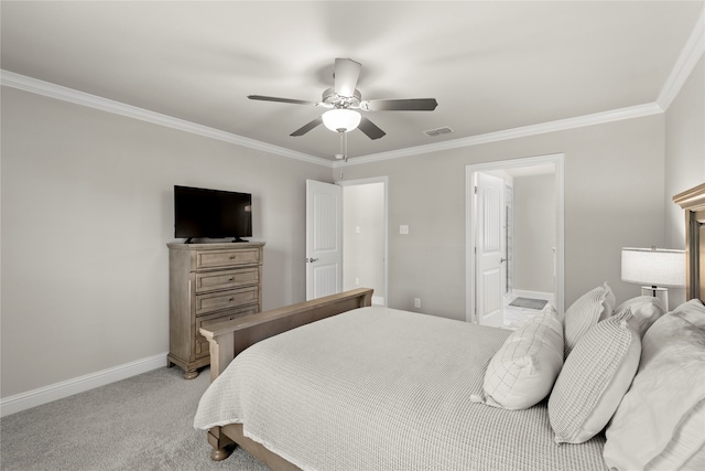 carpeted bedroom with ceiling fan, ornamental molding, and ensuite bath