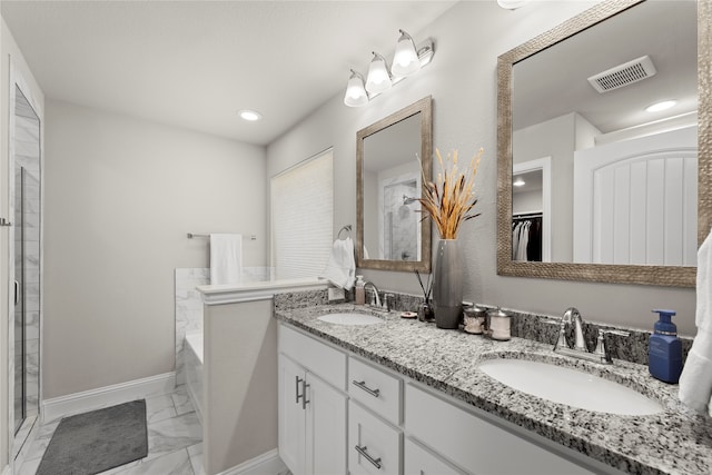 bathroom with a bathing tub and vanity