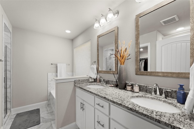 bathroom featuring independent shower and bath and vanity