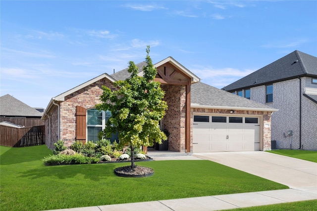 view of front of house featuring a garage and a front yard