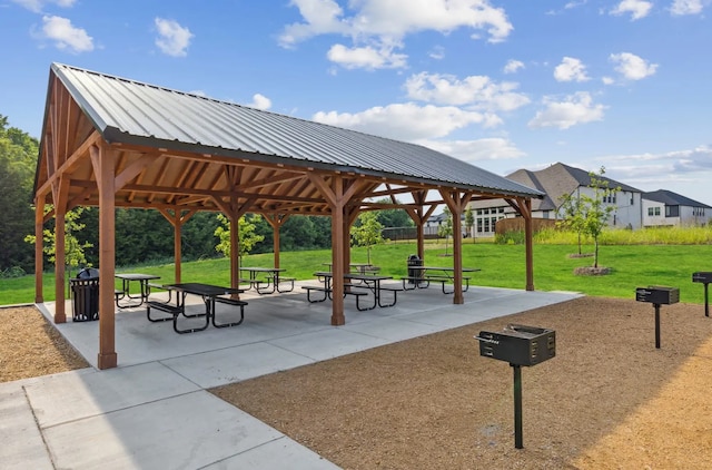 view of property's community featuring a gazebo, a yard, and a patio