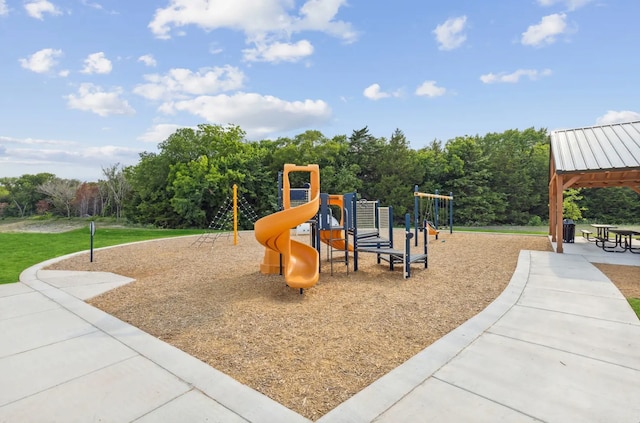 view of playground with a lawn and a gazebo