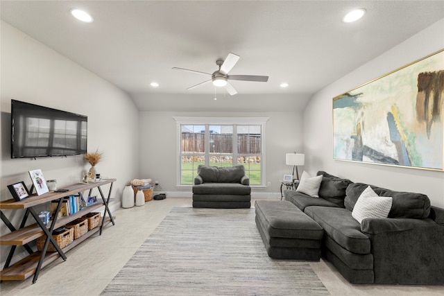 living room with ceiling fan and lofted ceiling