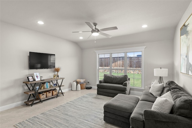 tiled living room featuring lofted ceiling and ceiling fan