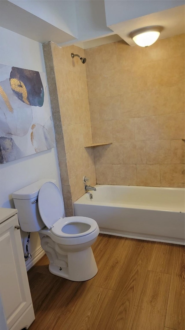 2001 Alma, Sherman, TX 75090 - bathroom featuring toilet, shower / tub combination, and wood finished floors