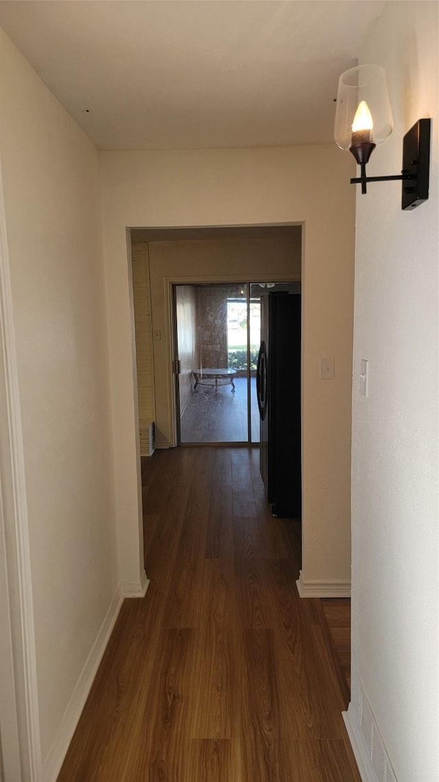 2001 Alma, Sherman, TX 75090 - corridor featuring dark wood-style floors and baseboards