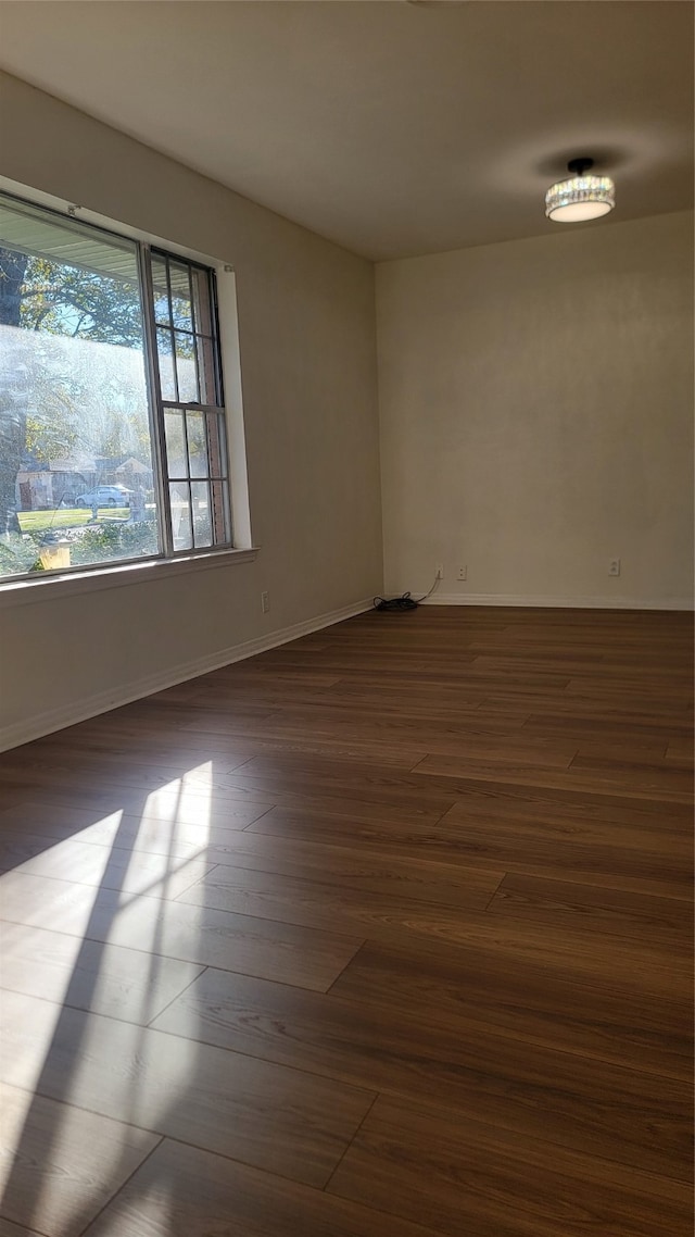 empty room featuring dark wood-type flooring