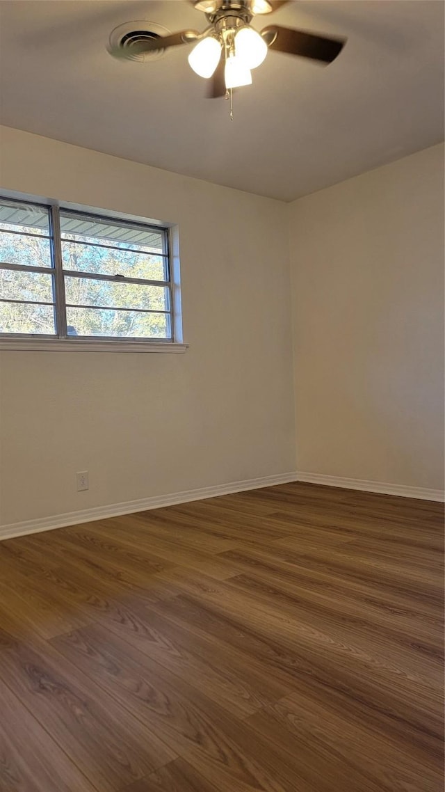 2001 Alma, Sherman, TX 75090 - empty room with ceiling fan, dark wood finished floors, and baseboards