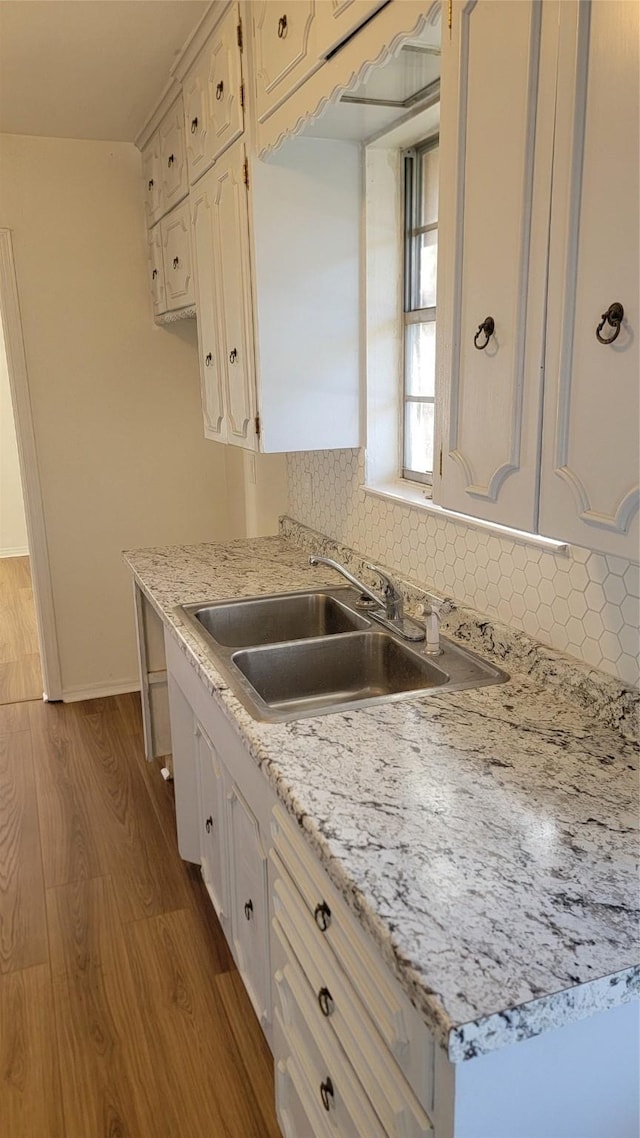 2001 Alma, Sherman, TX 75090 - kitchen featuring dark wood-style floors, a sink, tasteful backsplash, and light countertops