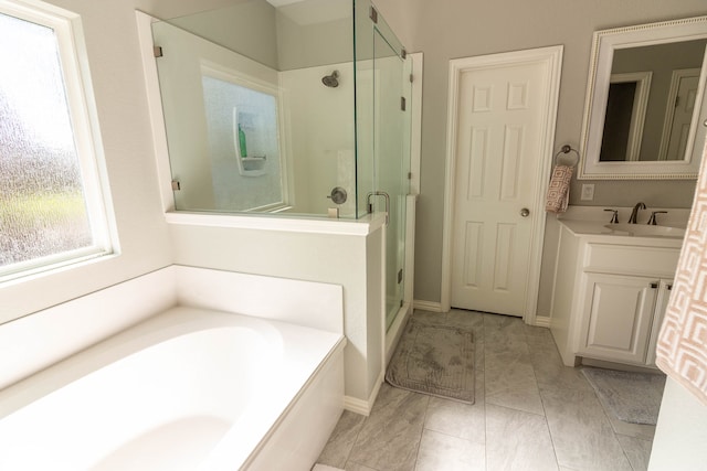 bathroom with separate shower and tub and vanity