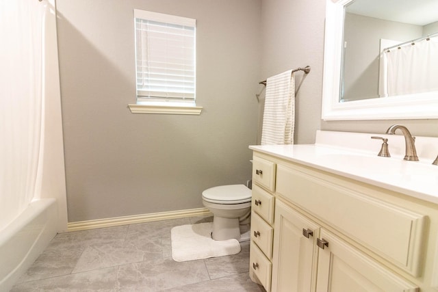 full bathroom with toilet, shower / bath combo, vanity, baseboards, and tile patterned floors