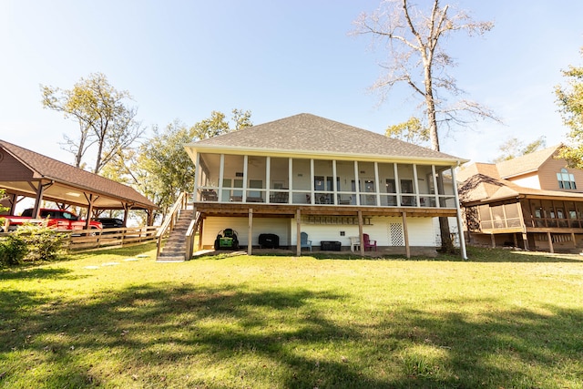 back of property featuring a yard and a sunroom