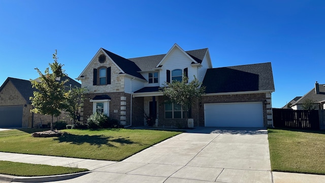 view of front of house featuring a front yard and a garage