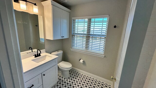 bathroom with vanity and toilet