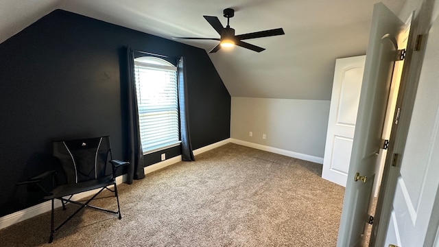 additional living space featuring ceiling fan, light colored carpet, and vaulted ceiling